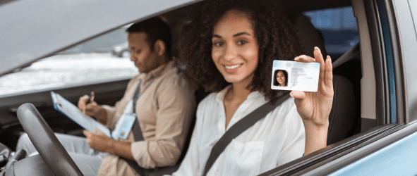 a lady on the driver seat showing her ID