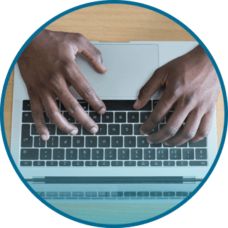 Hand typing on a keyboard